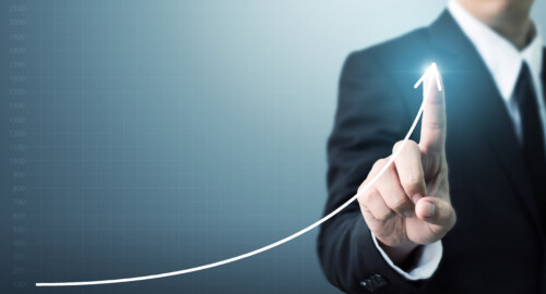 Businessman hand touching point graph growth or increase business chart Growing up revenue and development concept